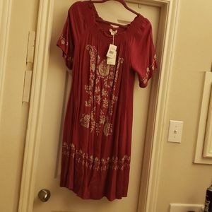 Living Doll, red flowy dress with floral detail all over!